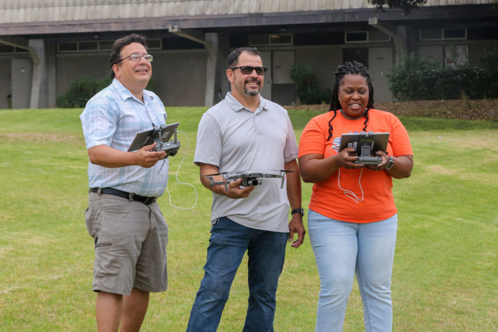 Students and faculty demonstrate the drone and technology