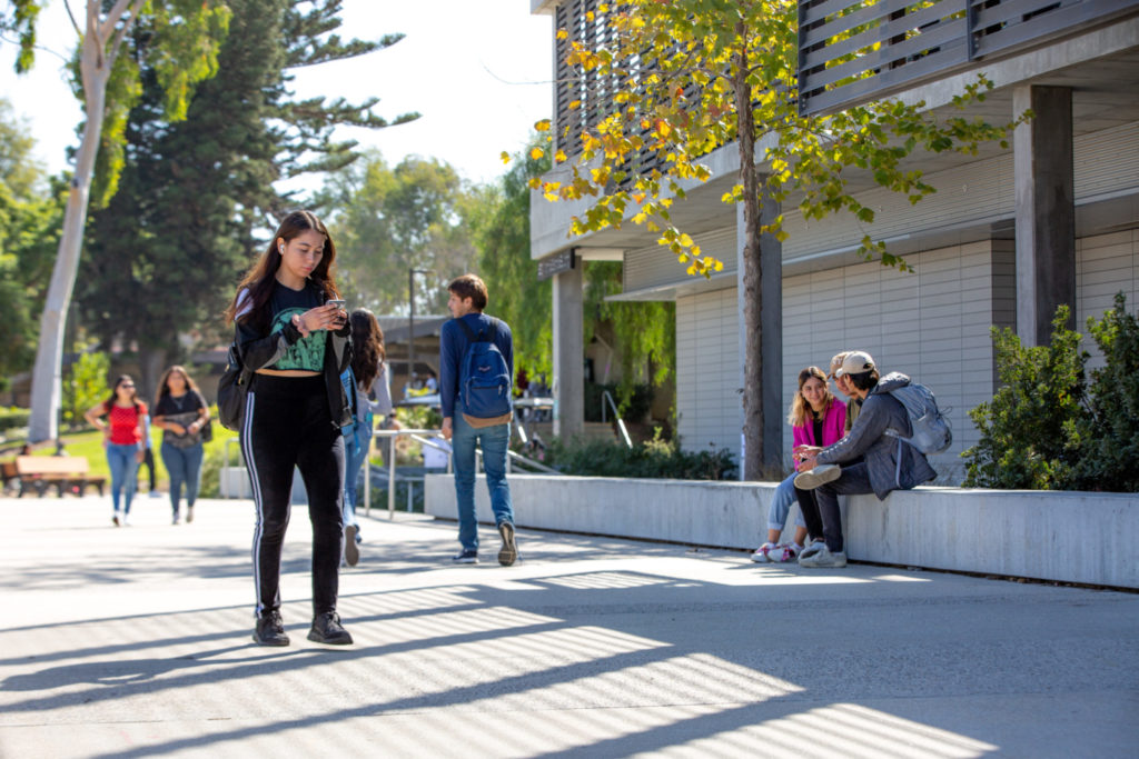 Students walking and talking near Math & Science Building
