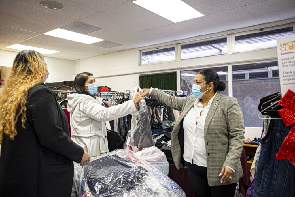 Chancellor Gonzales working with her team in the Cares Closet