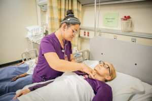 Southwestern College Vocational Nursing Program student treating another student.