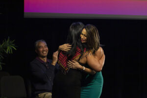 Southwestern College Professor of Communication, Dr. Llewelyn Labio hugging former Governing Board Trustee, Kirin Macapugay at the inaugural Asian and Pacific Islander Graduation Recognition Ceremony.